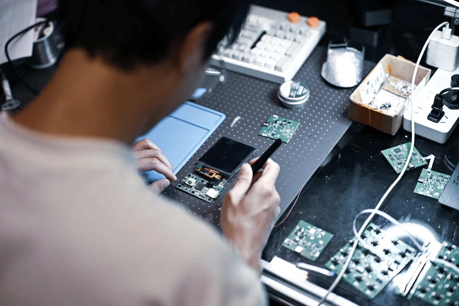 Inspecting the MASS X prototype at the workbench